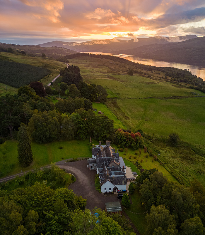 An aerial view of Stucktaymore and Loch Tay at sunset