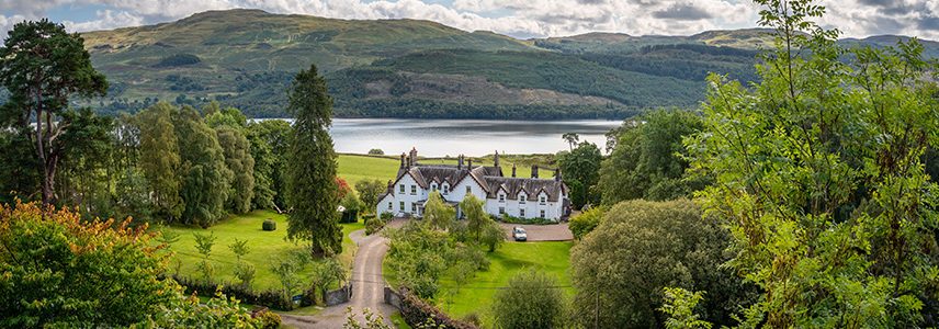 A view of Stucktaymore house with Loch Tay in the background