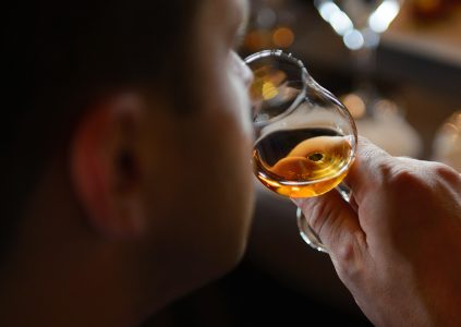 Man sampling a dram of whisky