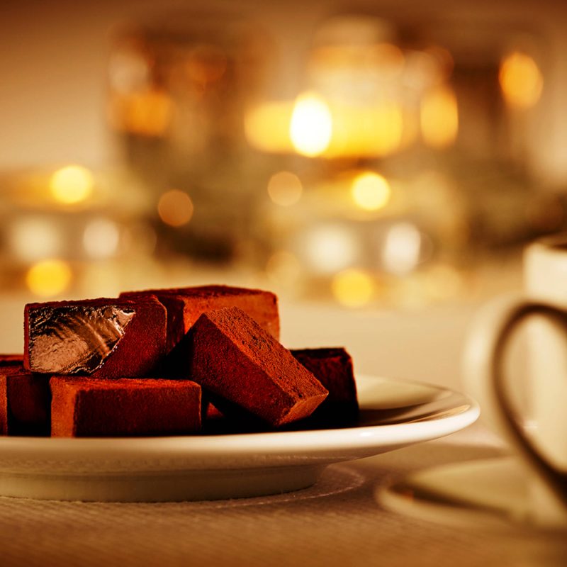 Plate of chocolates and mug of coffee at the Cjocolate Lounge, Iain Burnett Highland Chocolatier