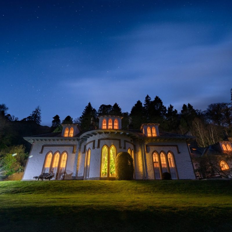 The exterior or the magnificent Stuckgowan house at night