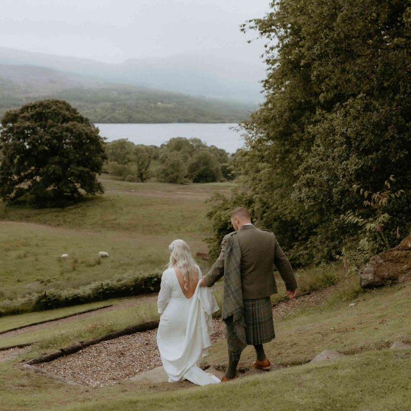 Bride and Groom walking down towards Loch Tay