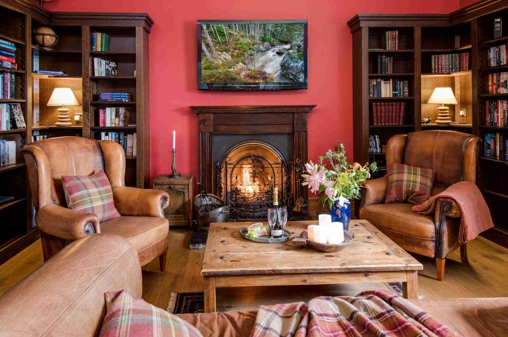 Library with fireplace in Stucktaymore House