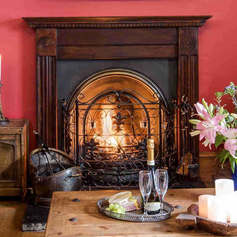 The library with a roaring fire in Stucktaymore House by Loch Tay