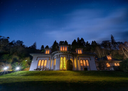 The exterior or the magnificent Stuckgowan House at night