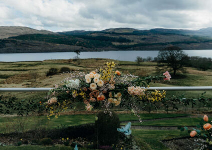 A beautiful bouquet of flowers on the glass balustrade on the terrace at Stucktaymore next to Loch Tay